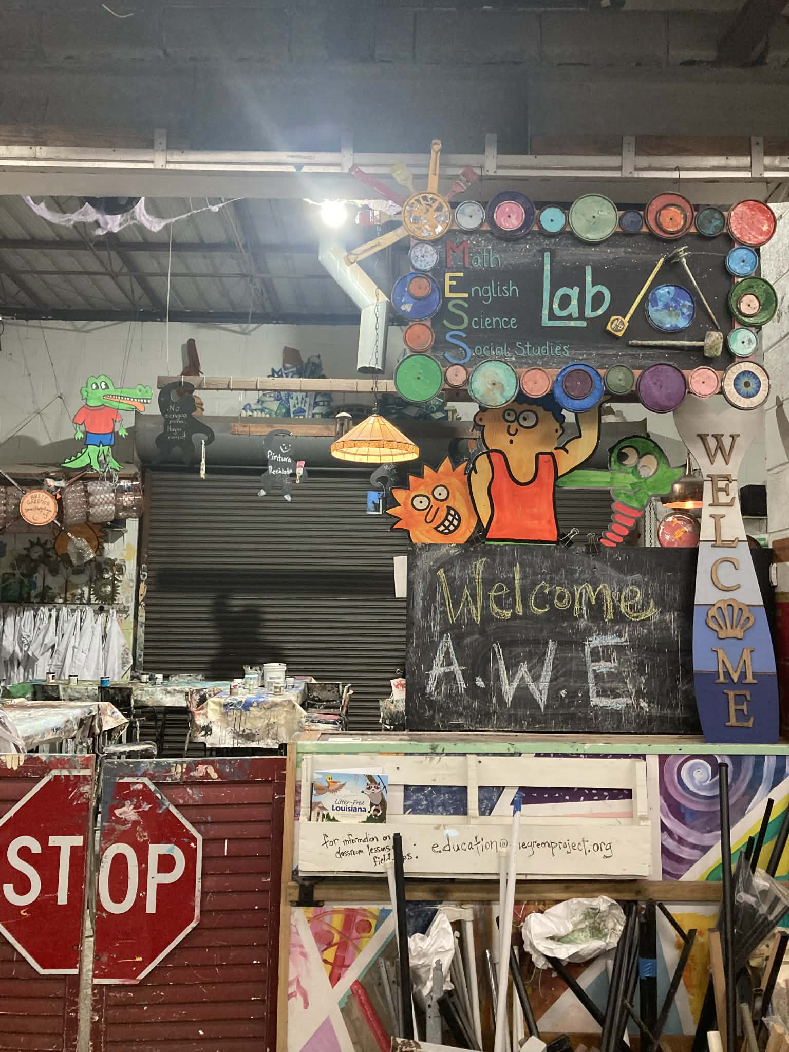 The Green Project welcome area with MESS Lab and creative paint can installations